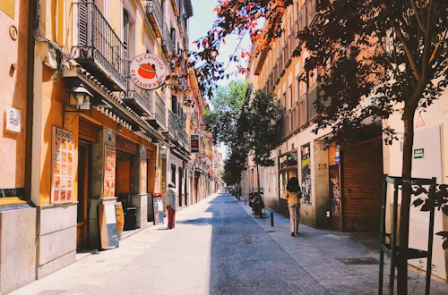 Madrid street with outdoor dining and traditional architecture